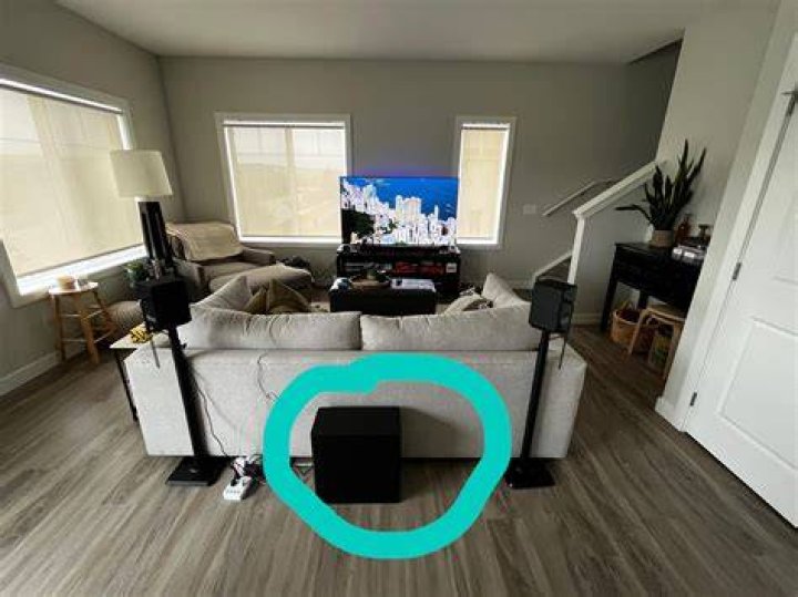 Can a subwoofer be enclosed in a cabinet?