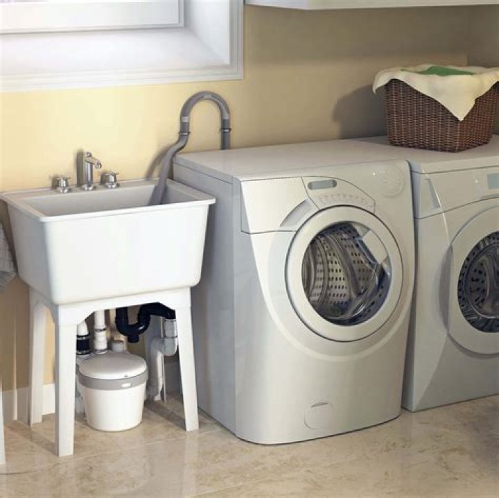 Can a washing machine and sink share a drain?