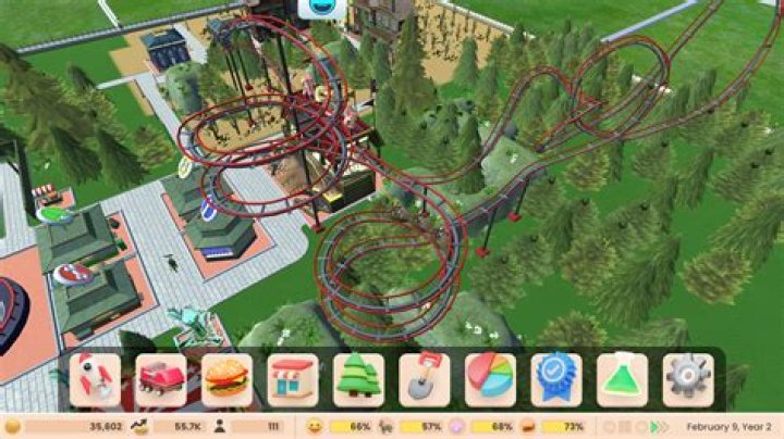 How do you activate cheats on RollerCoaster Tycoon 2?