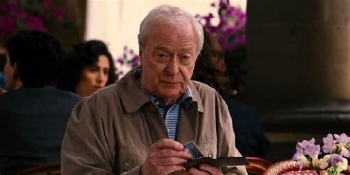 What did Alfred Michael Caine really see in that Italian cafe at the end of The Dark Knight Rises?