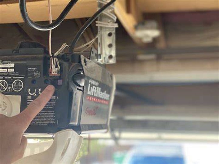 Where is the Learn button on a Challenger 9300 garage door opener?