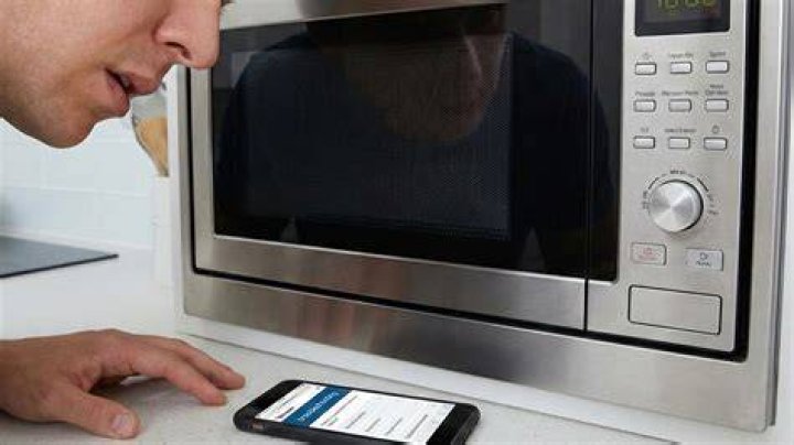 Why does my GE microwave make a buzzing sound?
